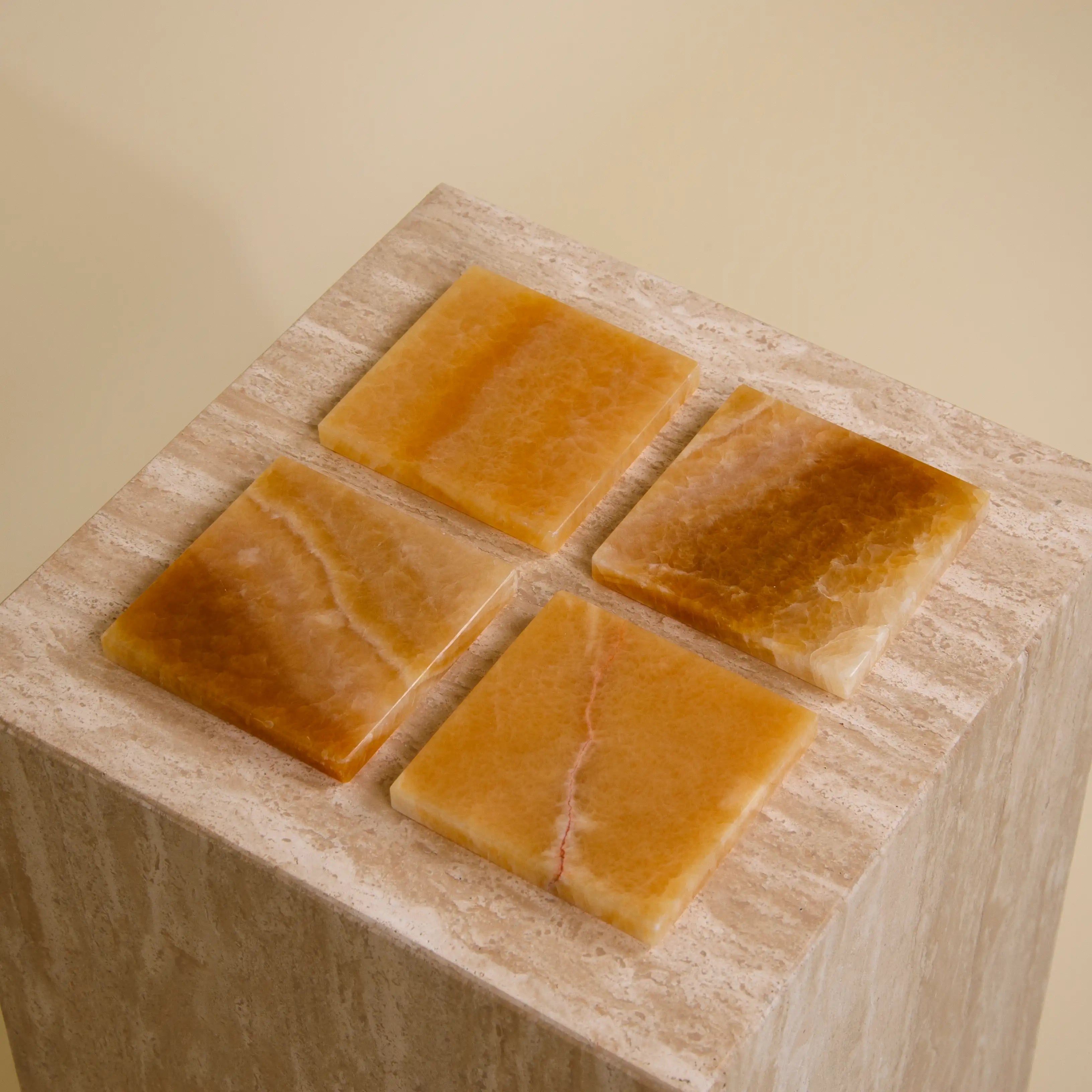 Aesthevore Custos coaster set of 4 honey onyx marble Tokyo Treasures interior design home decor styling on travertine table