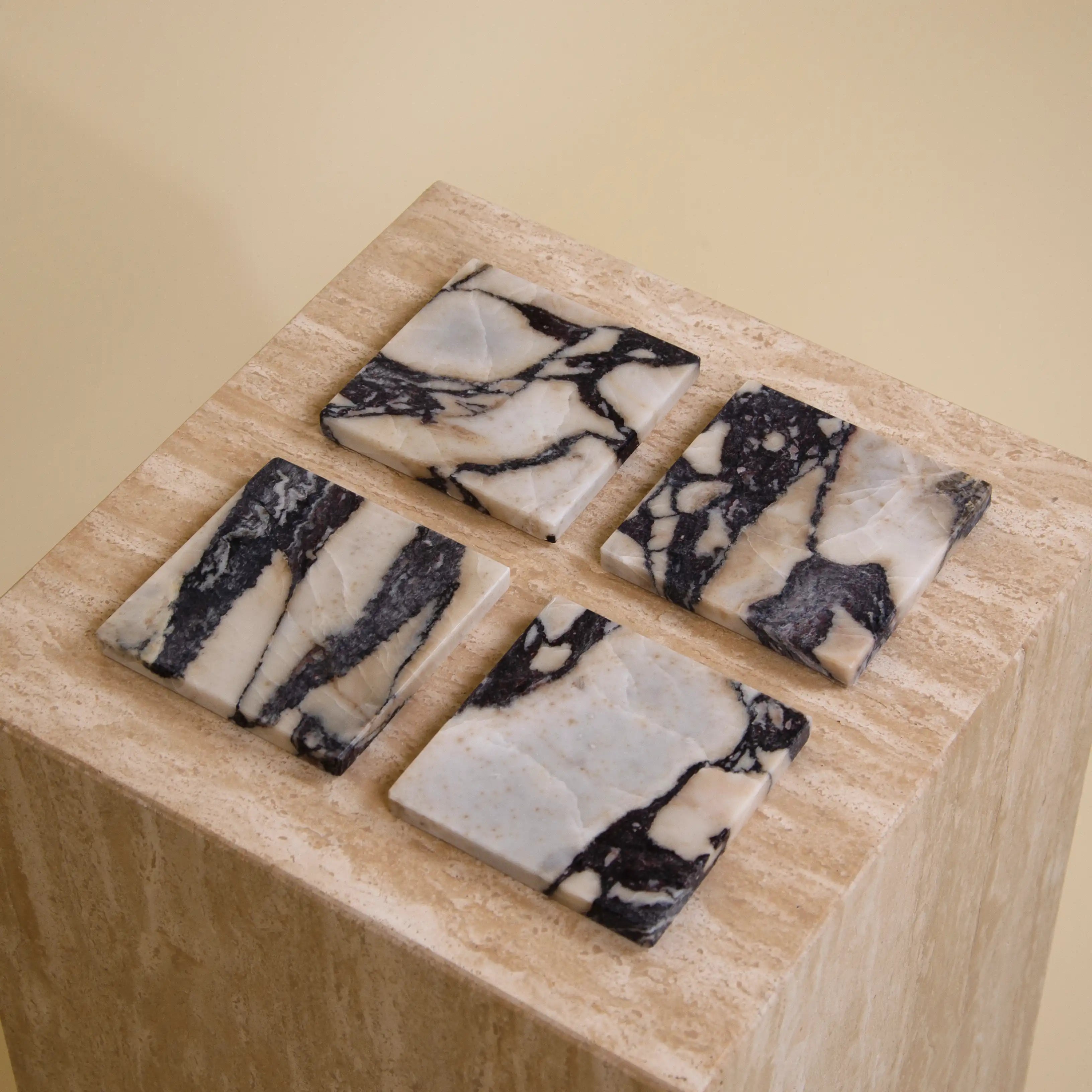 Aesthevore Custos coaster set of 4 viola calacatta marble New York Noblesse interior design home decor styling on travertine table