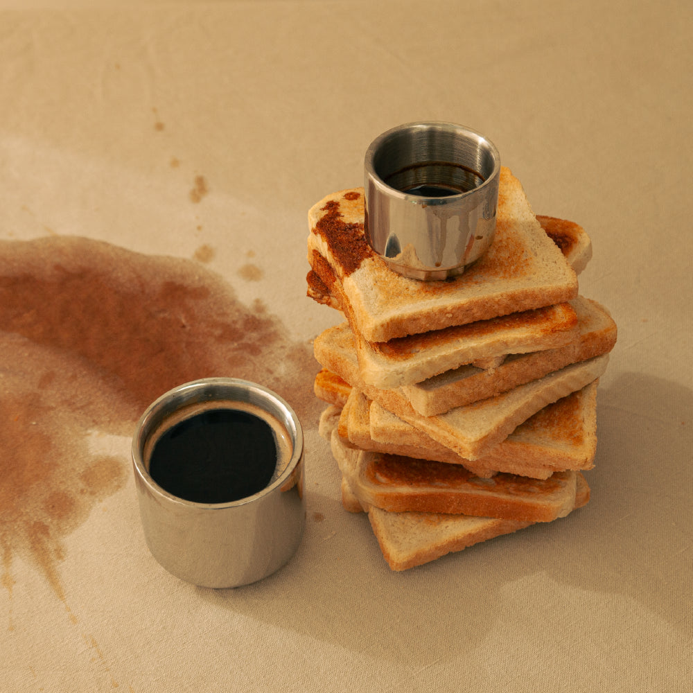 Steel Cups with Coffee and some fresh toasted toast