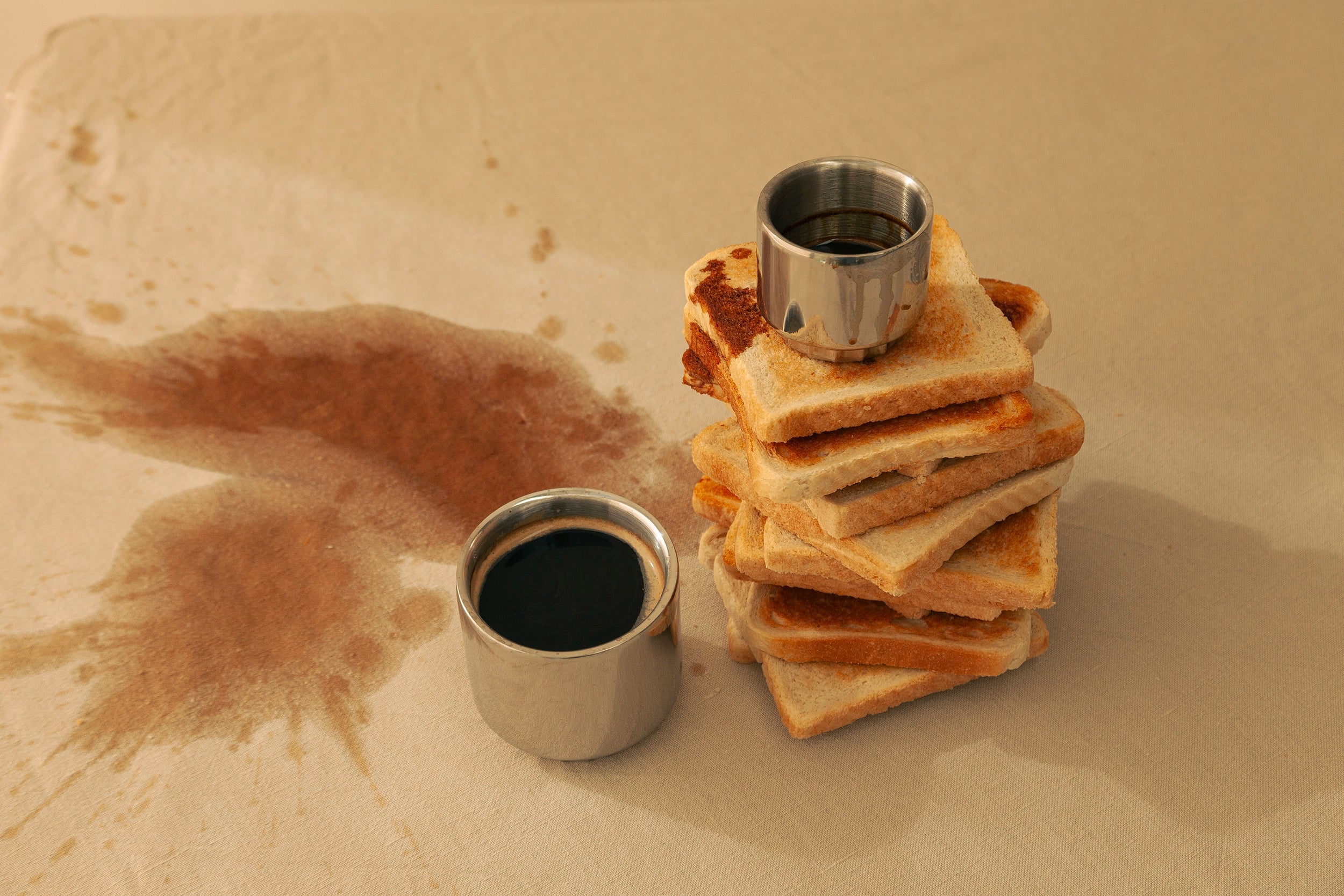Steel Cups with coffee and fresh toasted toast 